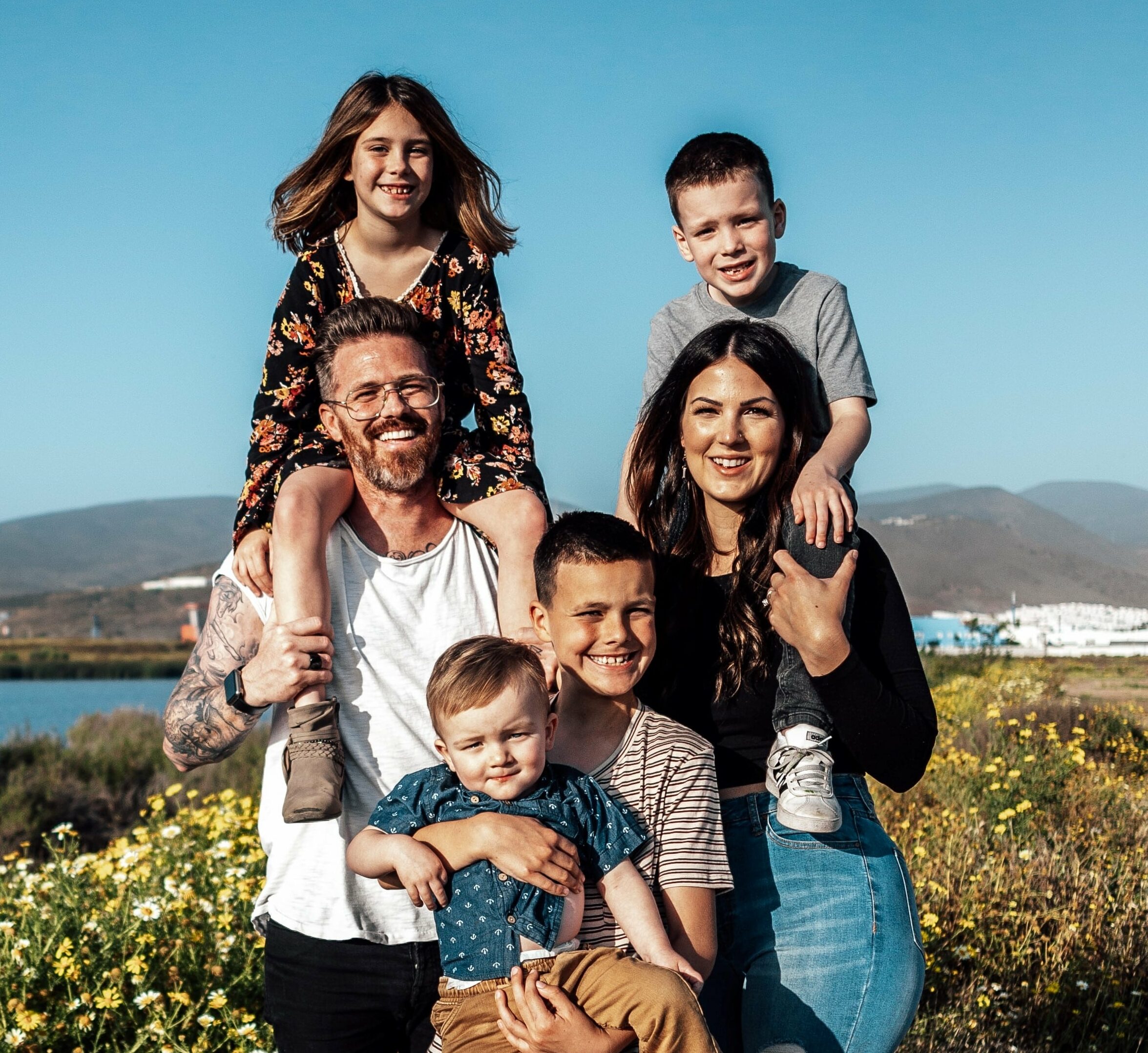 Want to become a host family? A host family in the US smiles for a family picture.