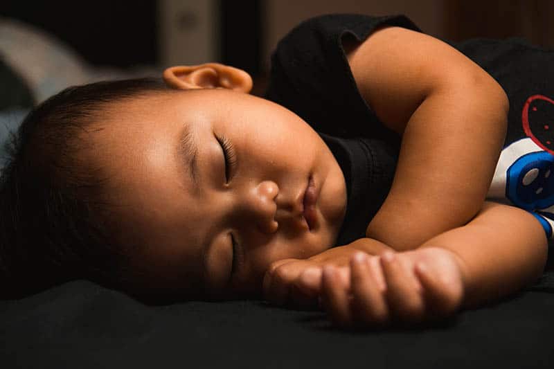 little boy in a deep sleep / bedtime child by age