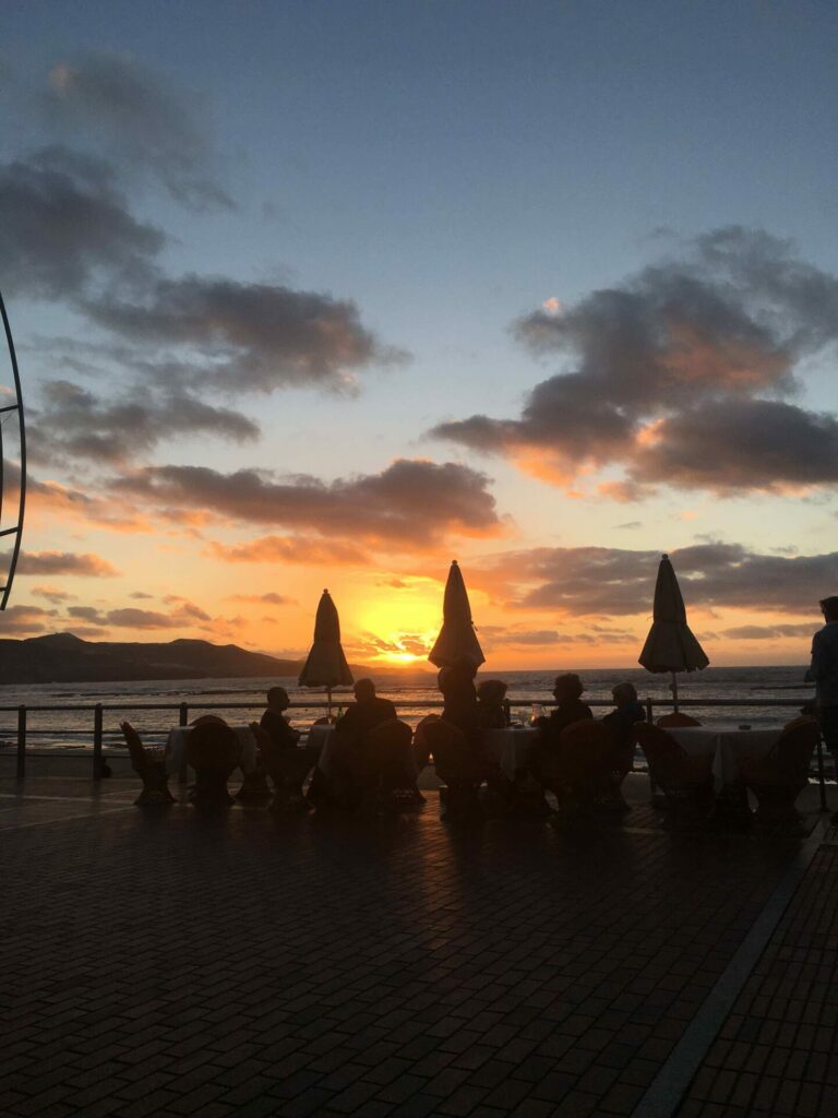 au pair viragini in gran canaria at the beach with a lovely sunset