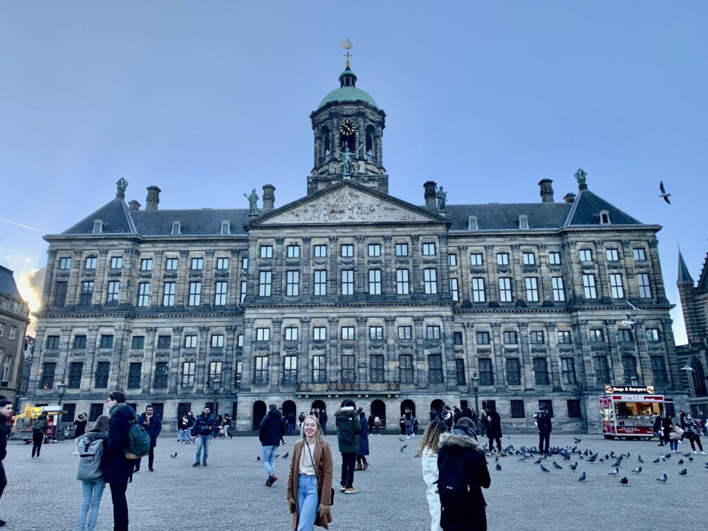 Au pair in the Netherlands Mia is standing on a square in Amsterdam