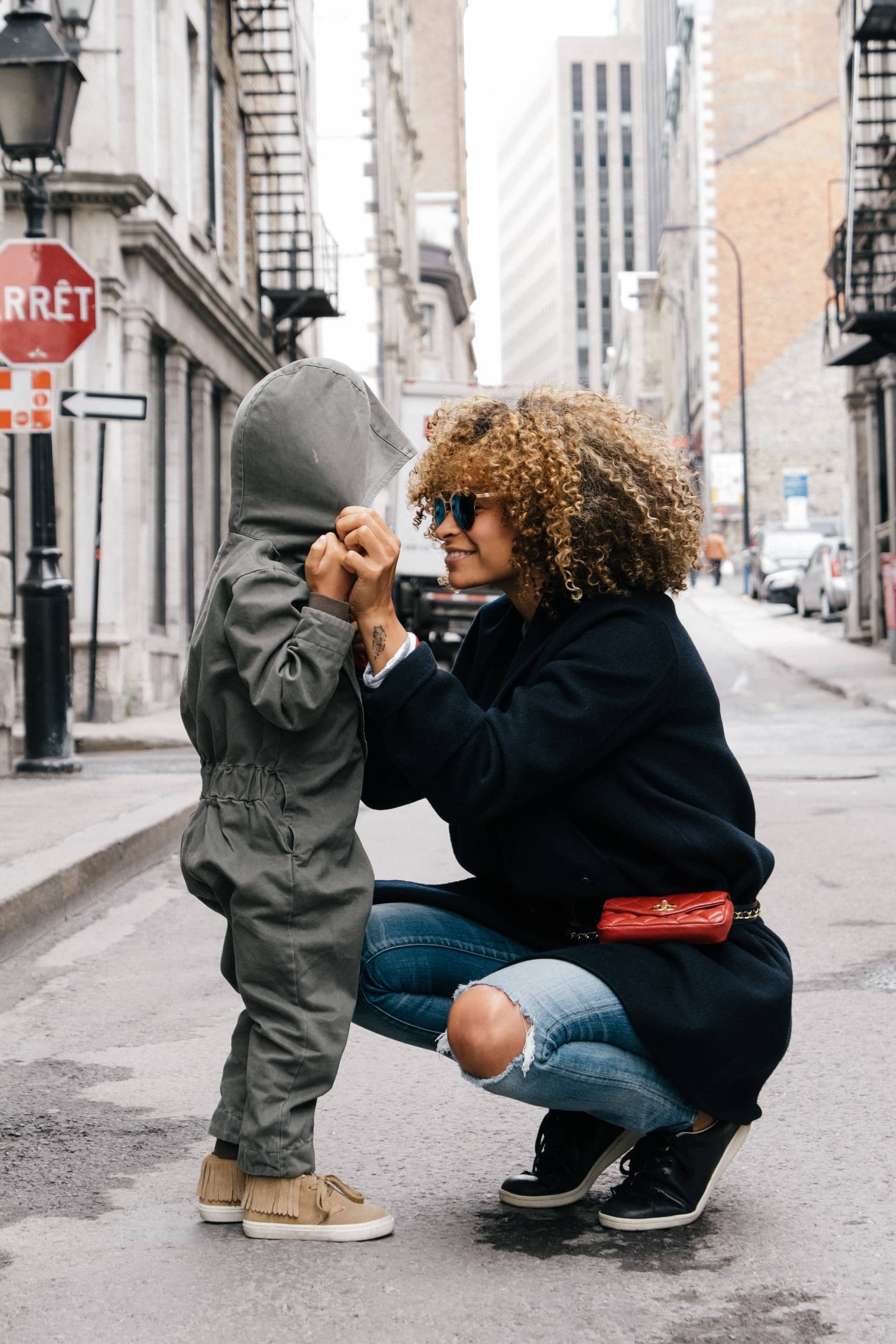 age limit of a babysitter look at this cute babysitter with a kid sitting down so she can explain something to him in a busy street